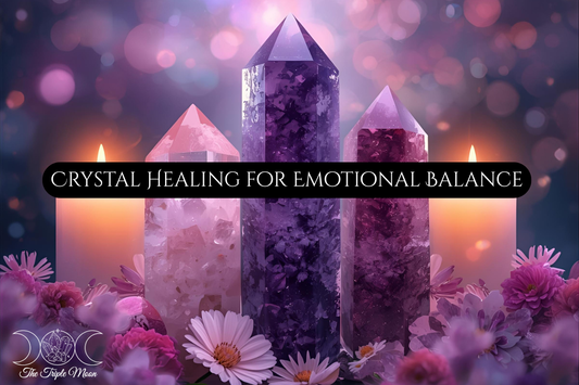 Rose quartz, amethyst, and lepidolite crystals displayed with candles and flowers. Blog post on crystal healing for emotional balance from The Triple Moon Blog.