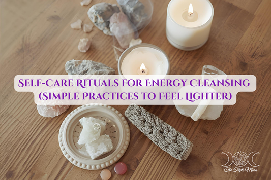 Candles, crystals, and sage arranged for a self-care energy cleansing ritual. Soft neutral aesthetic from The Triple Moon Blog.